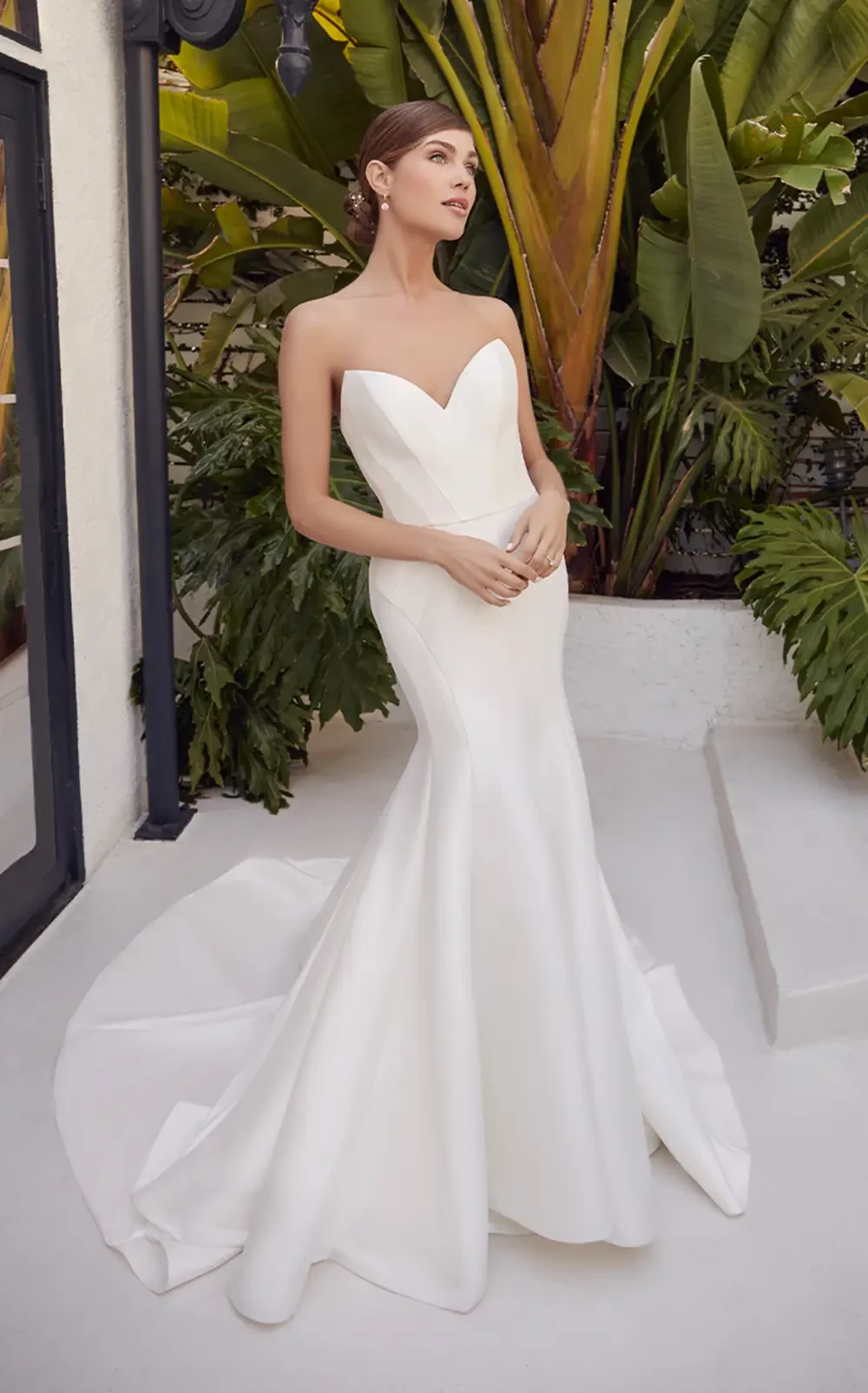 Model wearing a gown by Rebecca Ingram