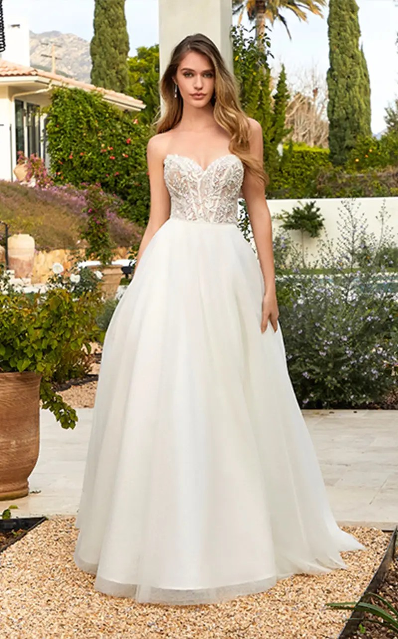 Model wearing a gown by Morilee