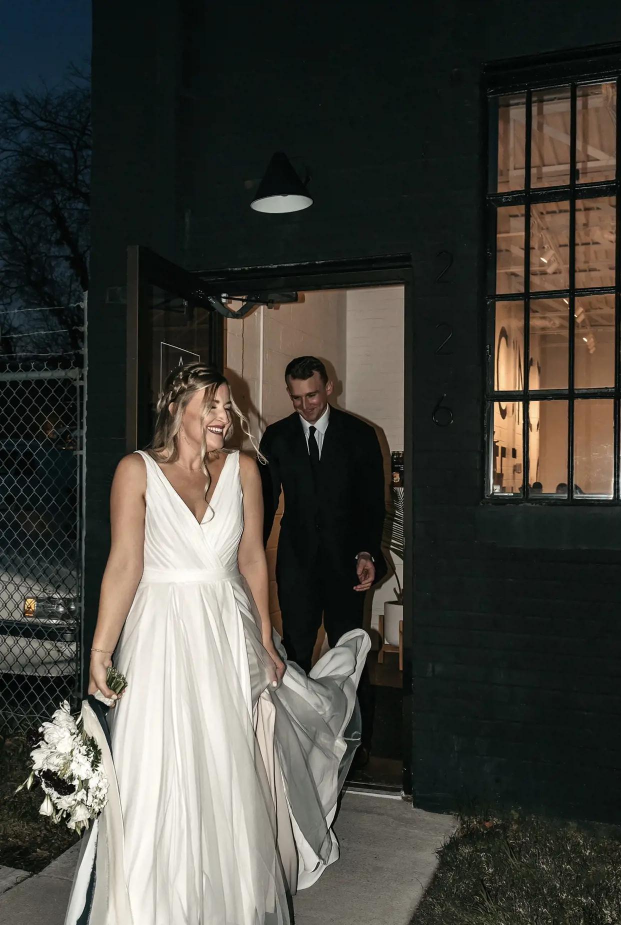 Coffee Shop Wedding Featuring Modest A-Line Wedding Dress and Smiling Bride and Groom Exiting An Industrial Coffee Shop