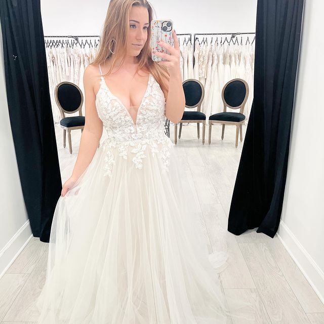 Model wearing a white gown